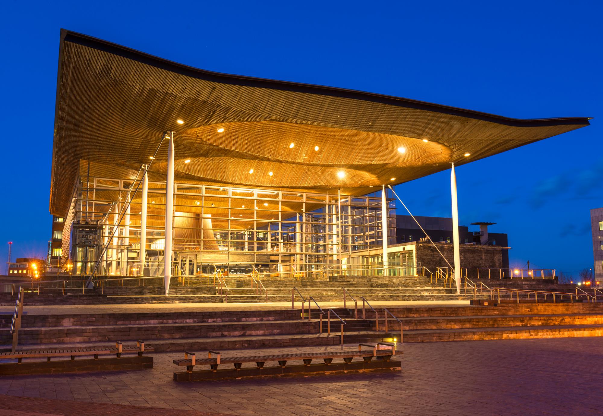 Wide angle view of The Senedd at dusk