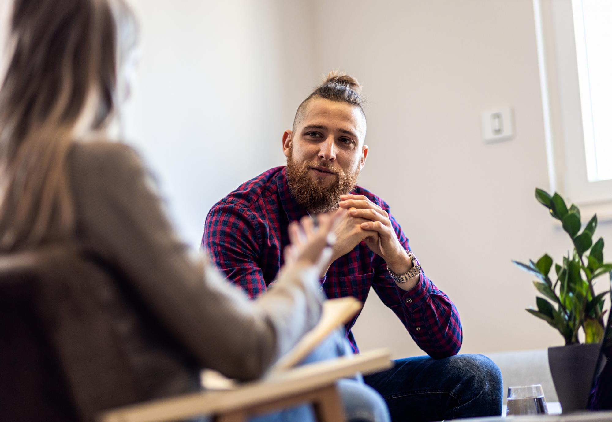 Young man talking to a therapist