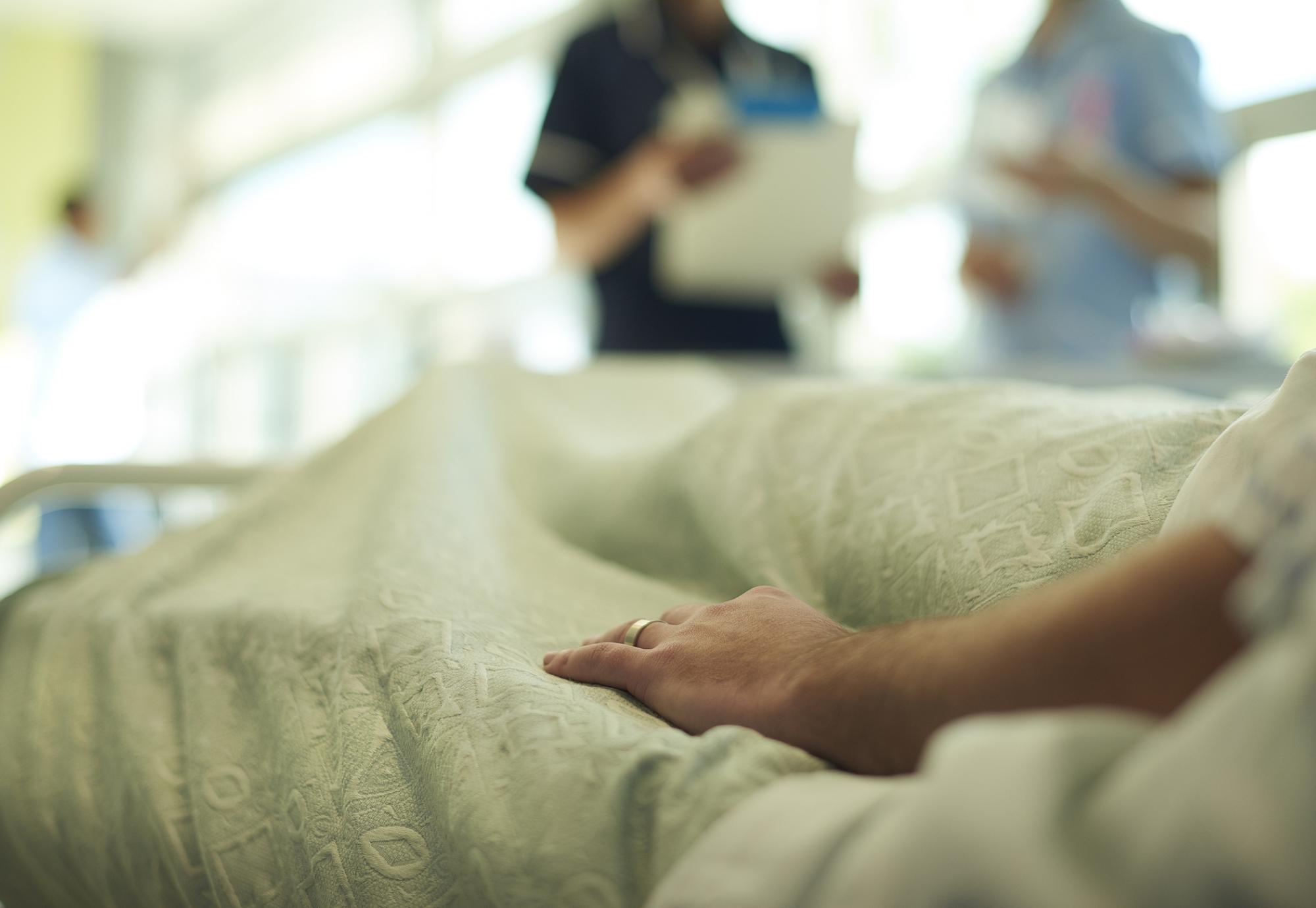 Person laying on a hospital bed