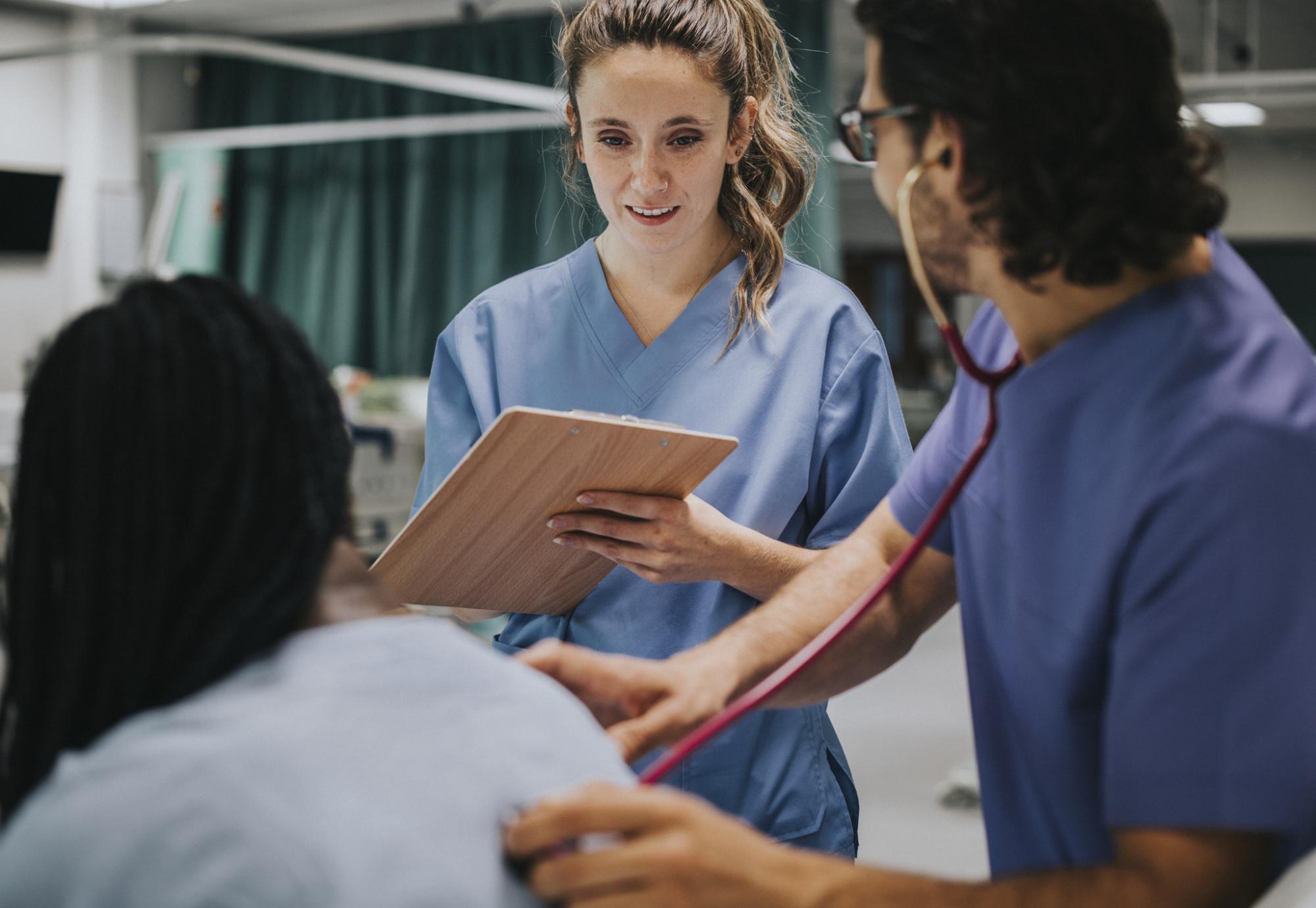 Young male physician examining a patient