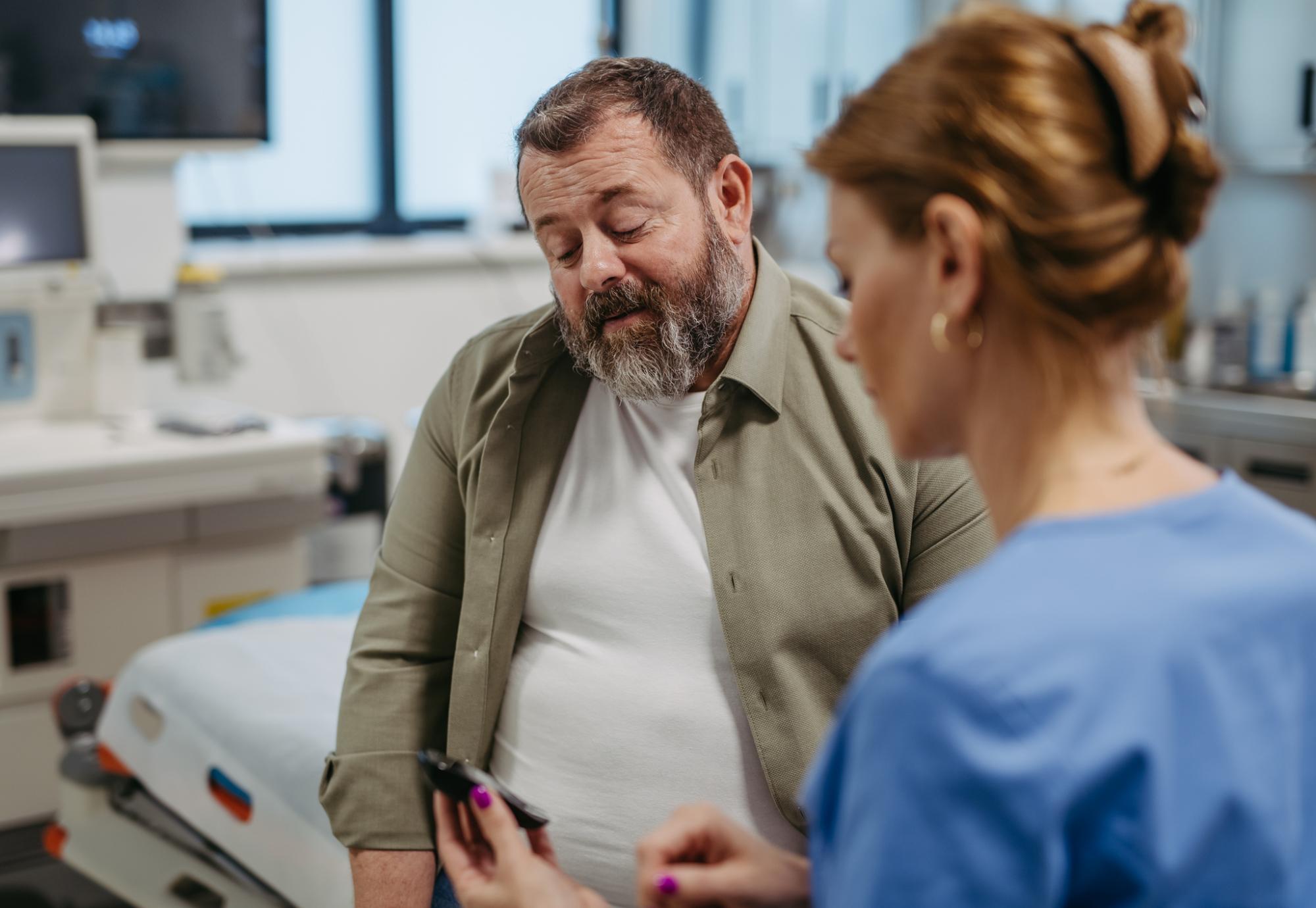 Doctor checking blood glucose level