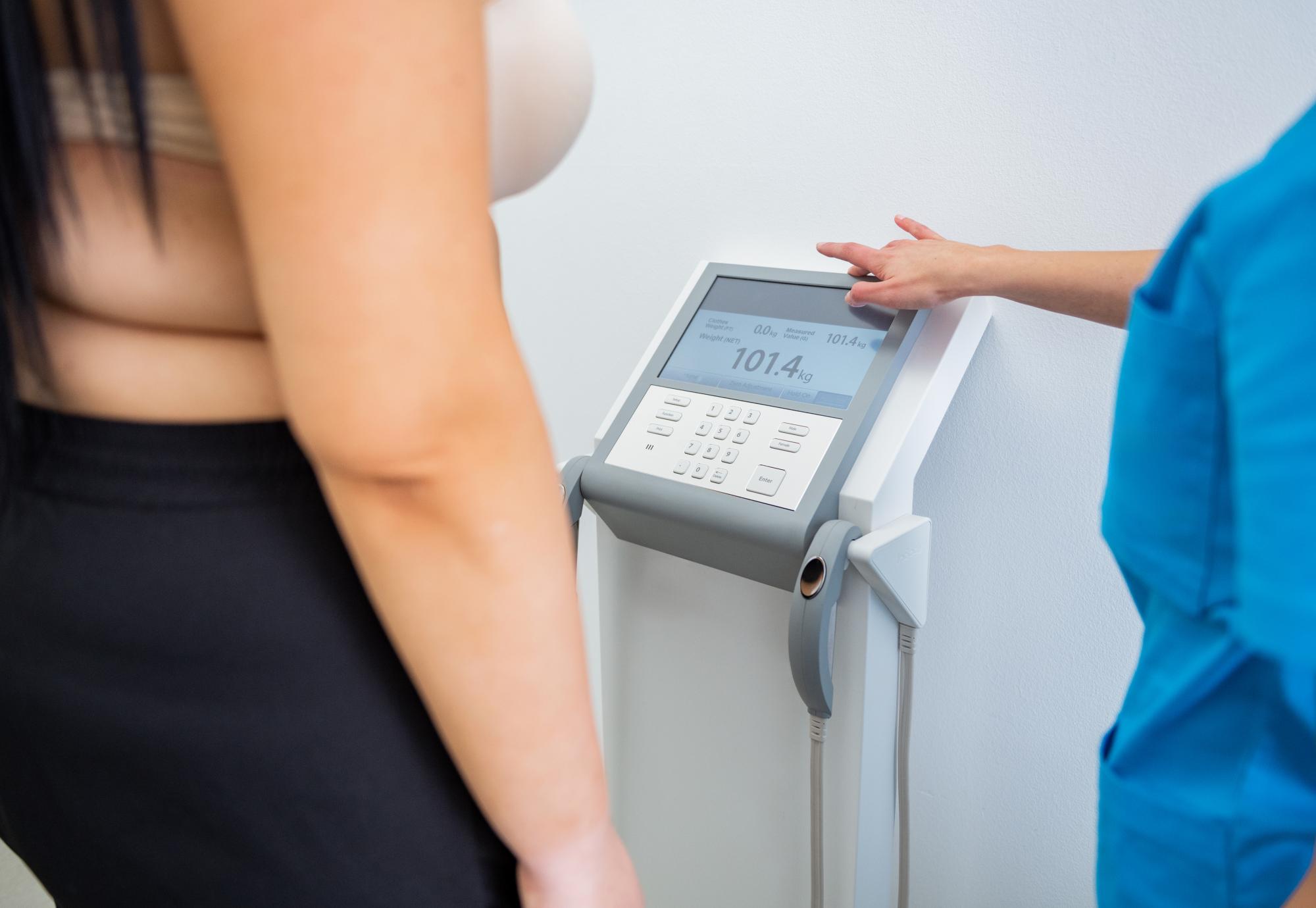 Nurse checks patient's BMI