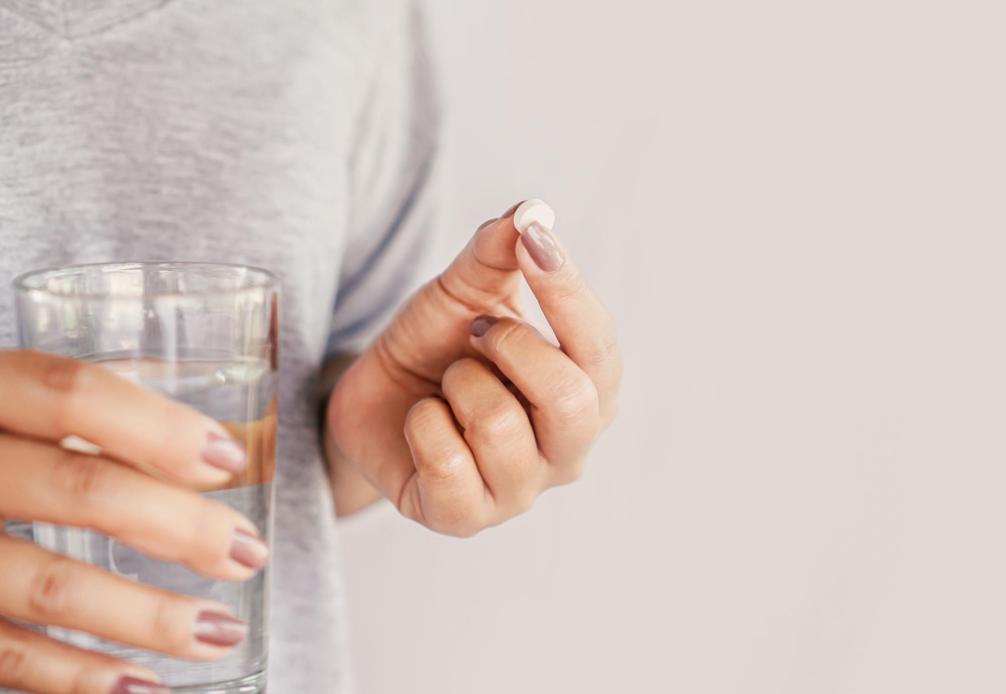 Woman taking a pill