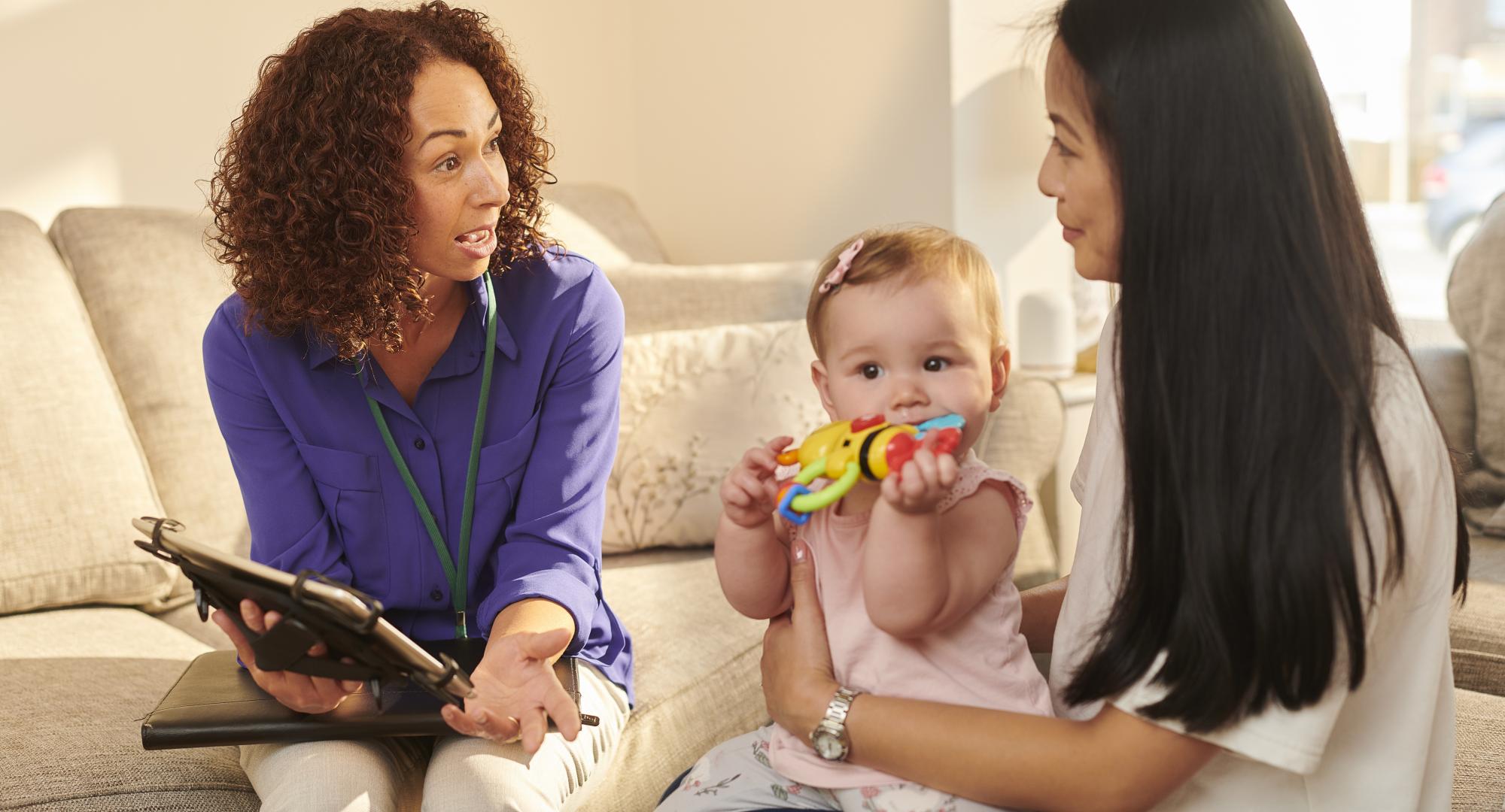 A health worker visiting a young family