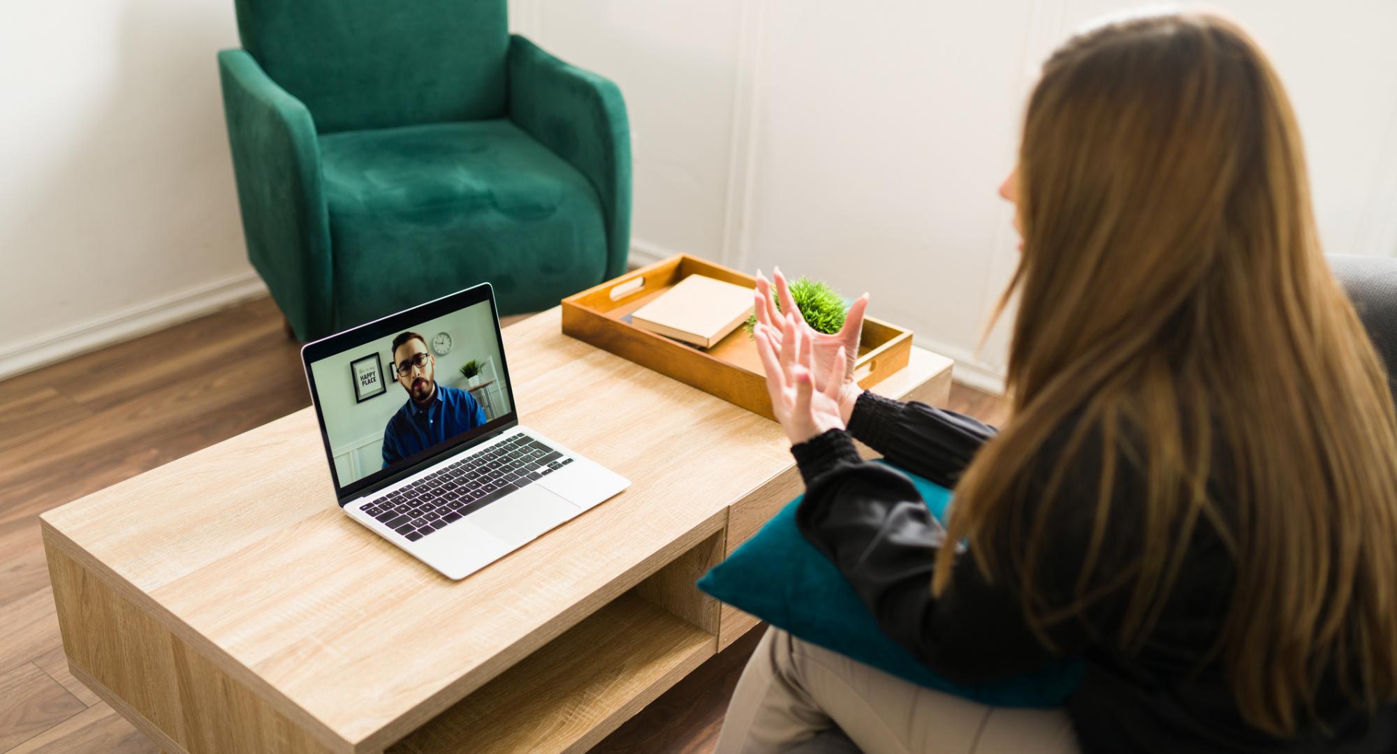 Woman talking to a virtual therapist