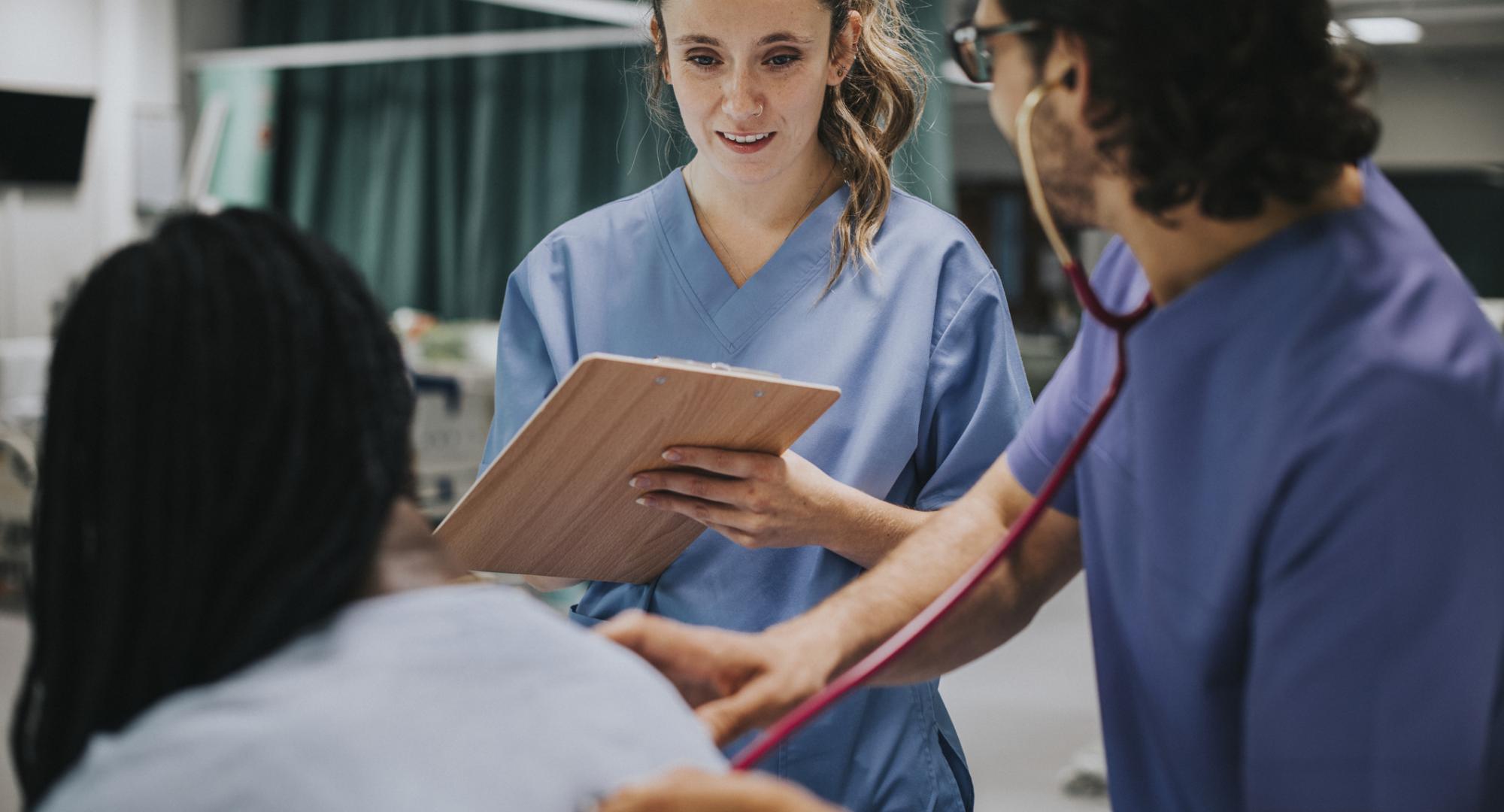 Young male physician examining a patient