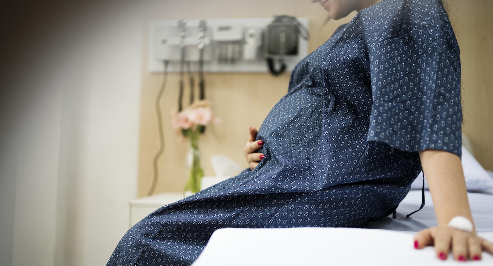Pregnant woman on bed