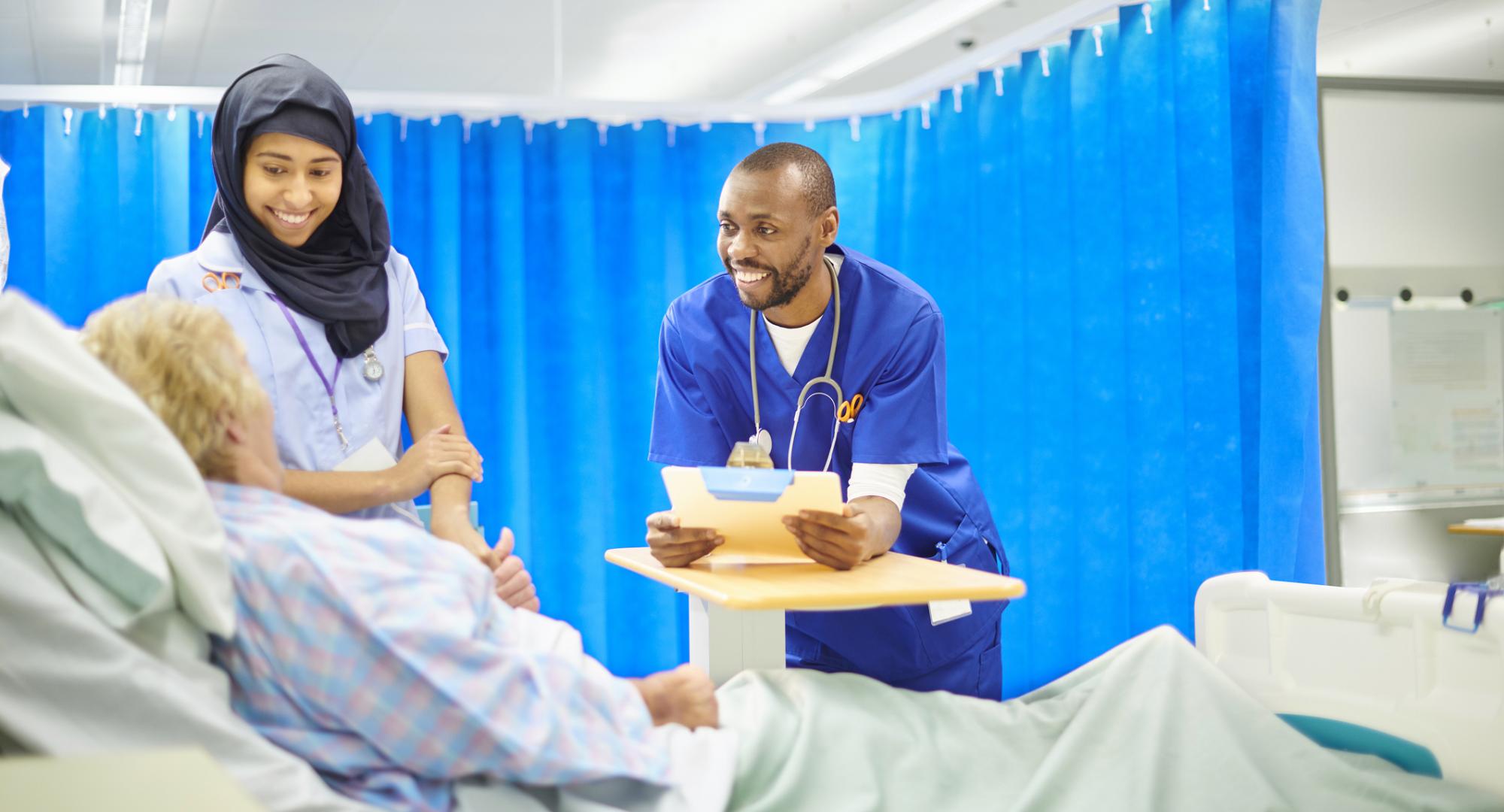 Two NHS staff with a patient