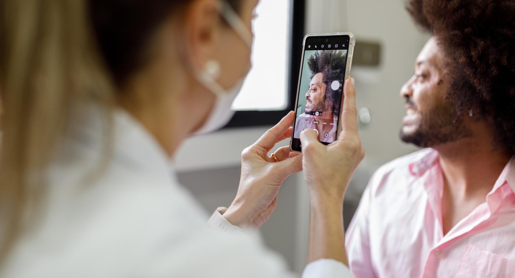 Doctor taking photo of an injury