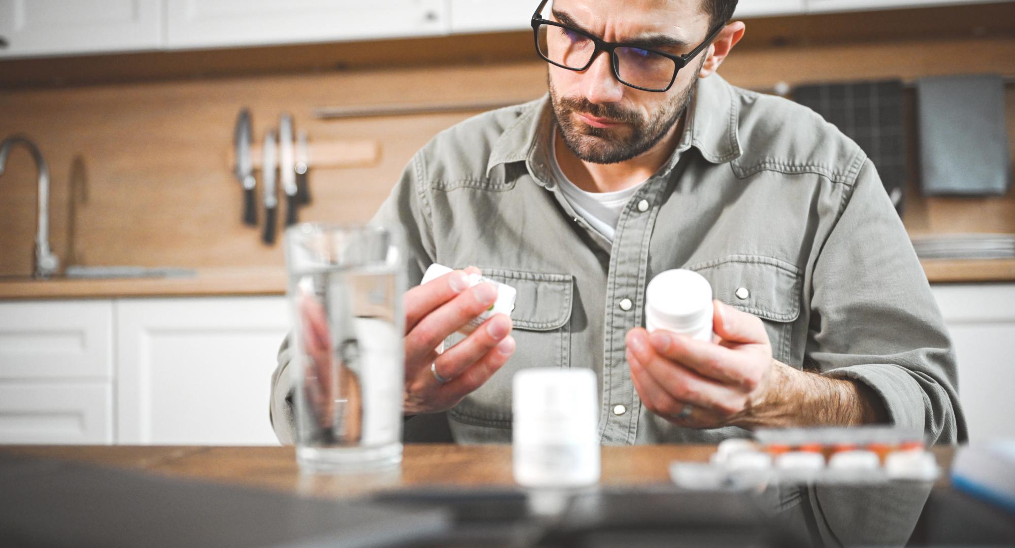 Man taking a pill