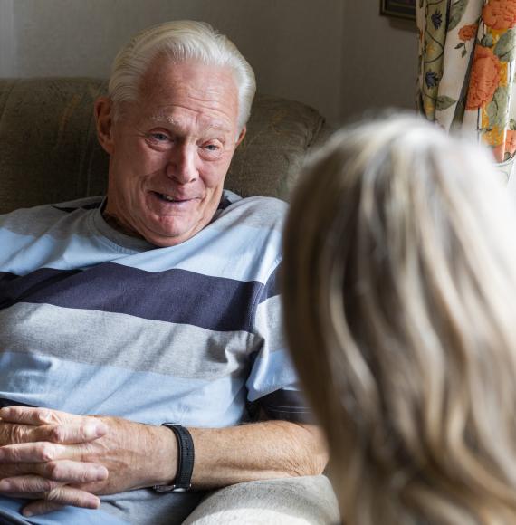 Nurse conversing with a senior patient