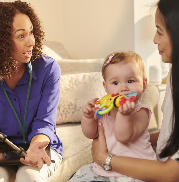 A health worker visiting a young family