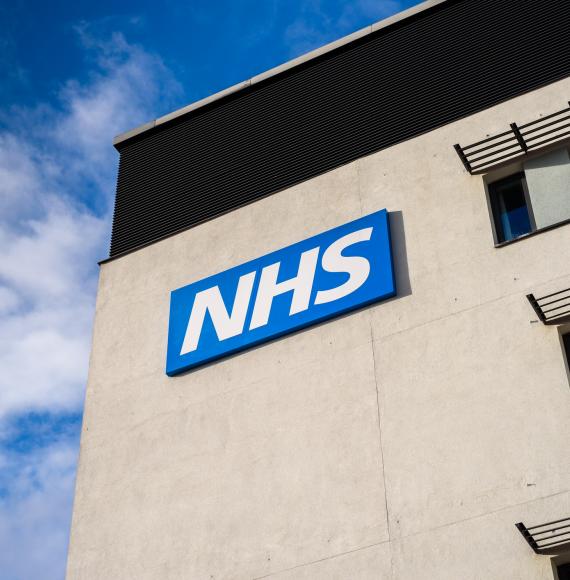 NHS logo on the side of a hospital