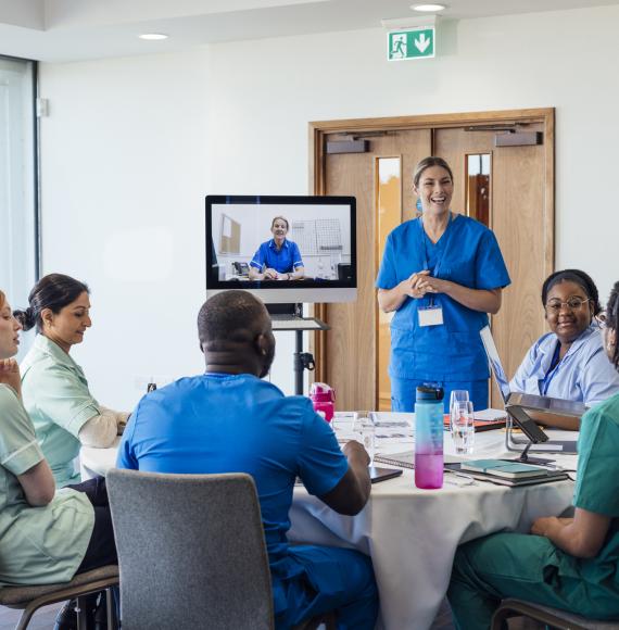 A group of healthcare professionals sitting around a table