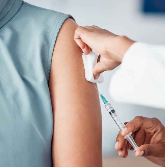 Doctor giving a patient a vaccination