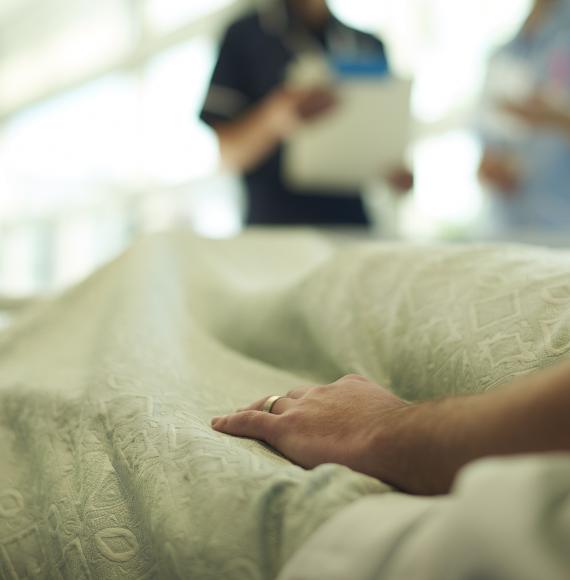 Person laying on a hospital bed