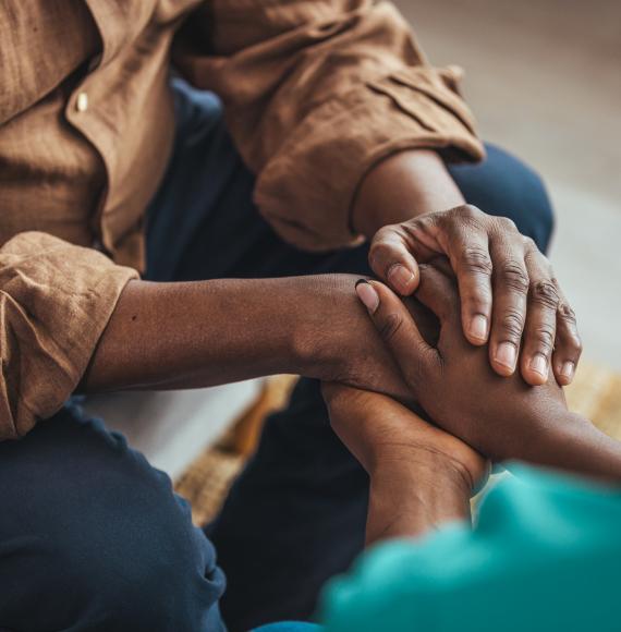 Two people holding hands