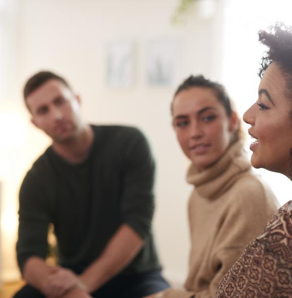 Woman Speaking At Support Group Meeting For Mental Health