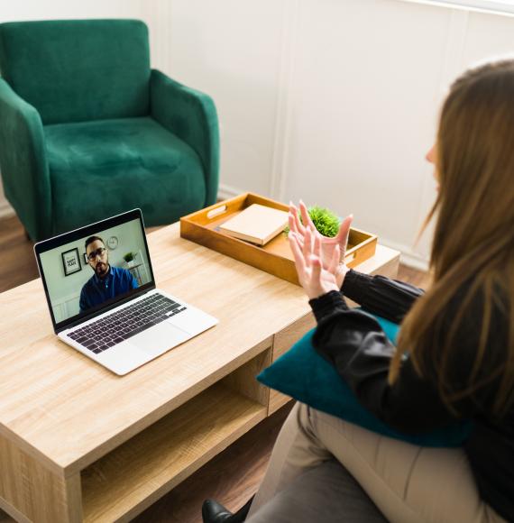 Woman talking to a virtual therapist