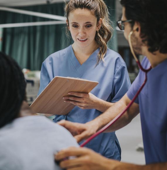 Young male physician examining a patient