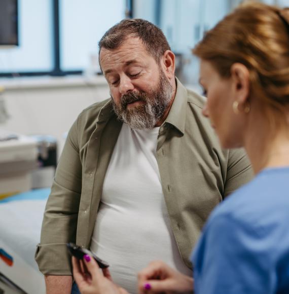 Doctor checking blood glucose level